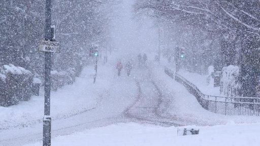 Snow showers by a road