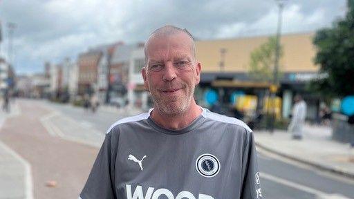 A man stood near The Spot in the city centre