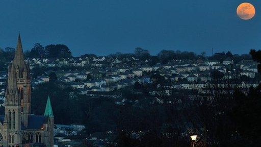 Full moon over a city