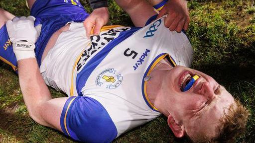 Peter Og McCartan collapses to the turf after kicking the winning score for Errigal Ciaran against Kilcoo in Sunday's Ulster club SFC title