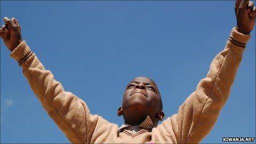 African boy cheering