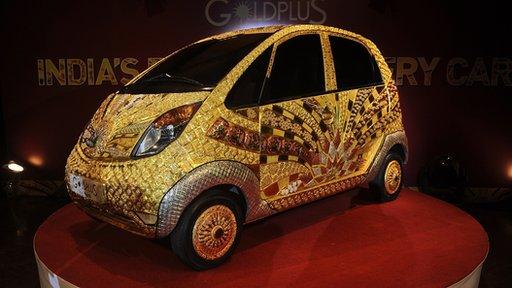 A custom Tata Motors "Nano" car adorned in gold, silver and gemstone trimmings