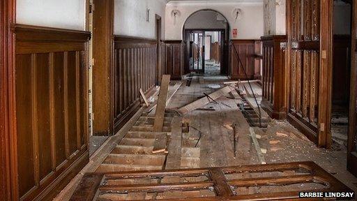 Ripped floorboards inside Ipswich's County Hall