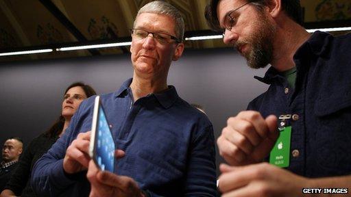 Tim Cook with iPad Mini