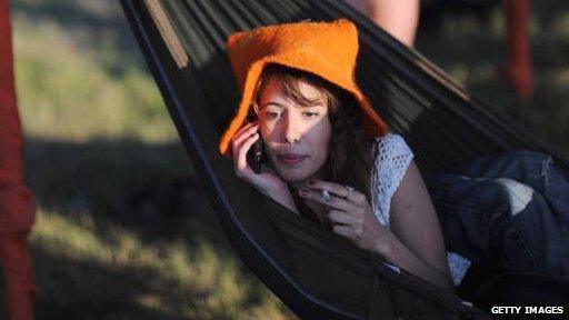 lady on phone in hammock