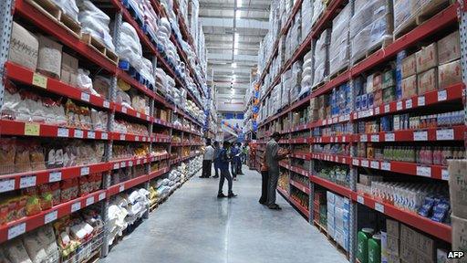 Shoppers browse through the products of a newly opened Bharti Wal-Mart Best Price Modern wholesale store in India