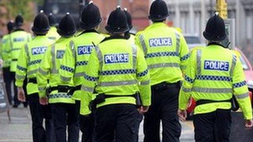 Police officers in high-visibility coats