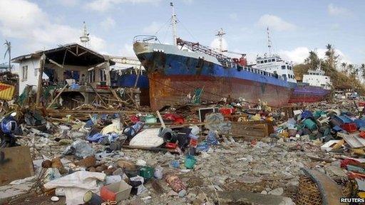 Cargo ships washed ashore are seen four days after super typhoon Haiyan hit Anibong town, Tacloban city, central Philippines November 11, 2013.