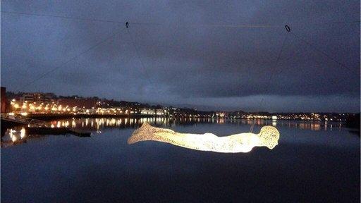 Illuminated sculpture suspended over River Foyle