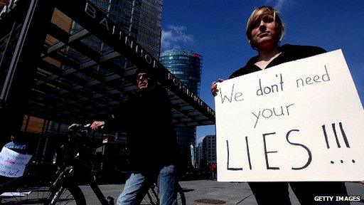 Woman holding a poster