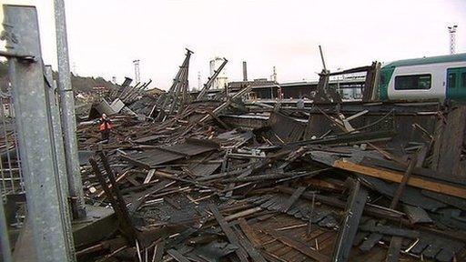 Storms ripped a 400m wooden canopy from its foundations and threw it onto a train at a railway station in Cork