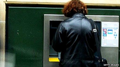 Woman at cash machine