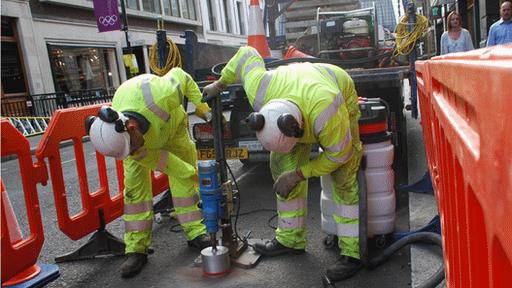 Men laying parking sensors