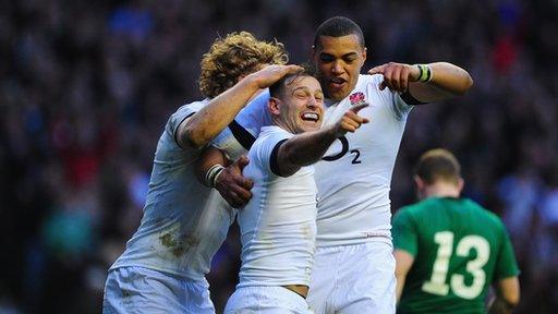 Danny Care celebrates after scoring England's try against Ireland with Billy Twelvetrees (l) and Luther Burrell