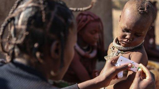 A child being tested for malnutrition