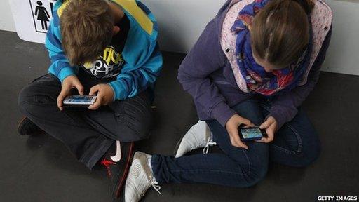 Children using mobile phones