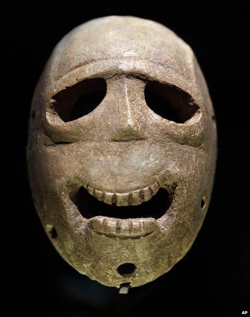 A 9,000 year-old mask is on display at the Israel Museum in Jerusalem on 10 March 2014.