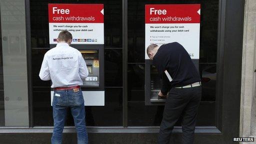 Men using cash machines