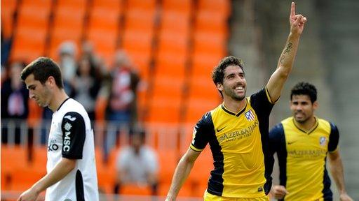 Raul Garcia celebrates scoring for Atletico Madrid against Valencia