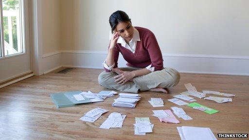 woman examines bills