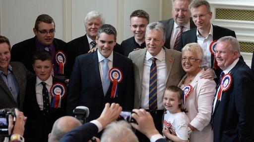 Peter Robinson greets councillors at city hall