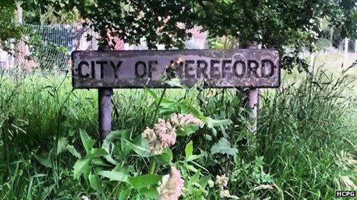 Overgrown City of Hereford sign