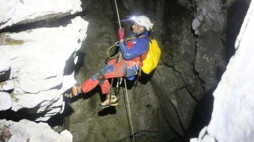 Rescuer enters cave near Berchtesgaden