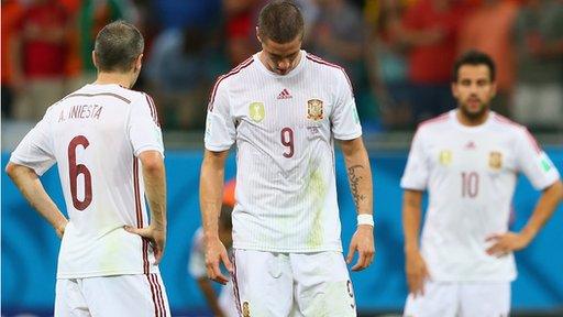 Spain's Andres Iniesta, Fernando Torres and Cesc Fabregas look dejected during the 5-1 defeat by the Netherlands