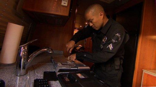 Officer removes hard drive