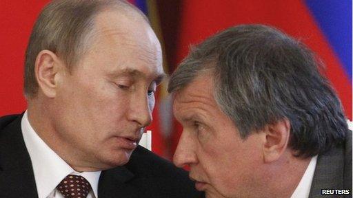 Russian President Vladimir Putin (left) talks to Rosneft President Igor Sechin