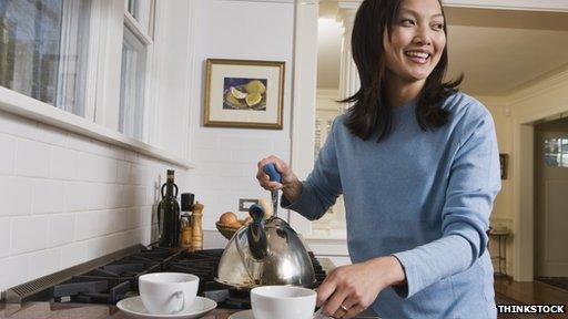 A woman with a kettle