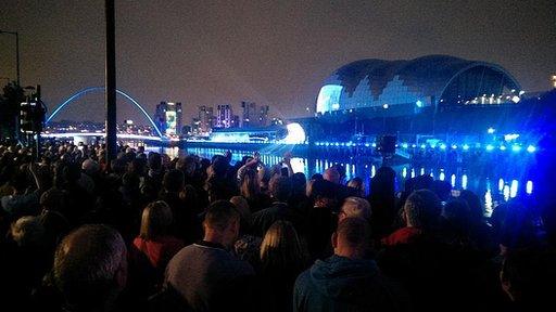 Crowds watch the millionth finisher ceremony