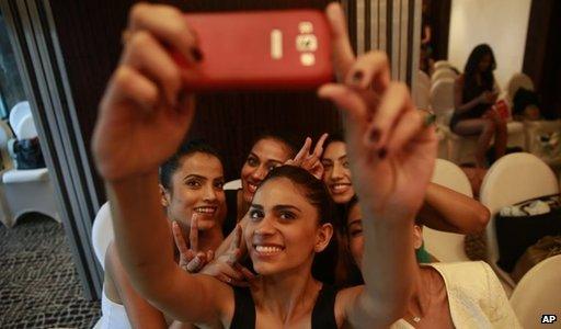 Indian women take selfie with a smartphone