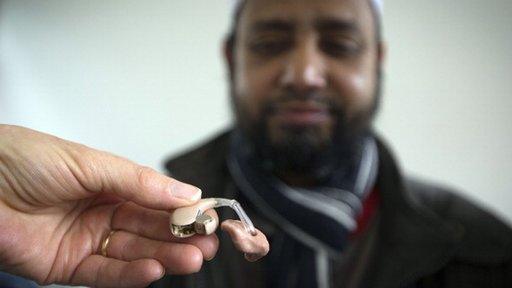 man and hearing aid
