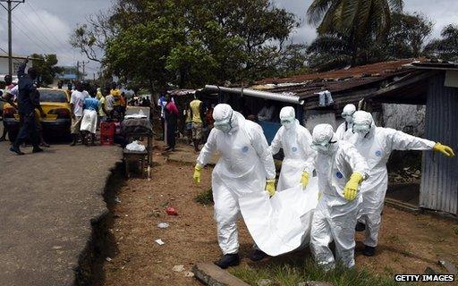 Red Cross workers in the Liberian capital Monrovia