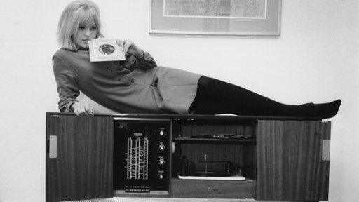 Annie Nightingale on a record player, 1964