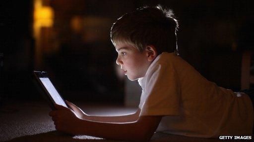 boy looking at tablet