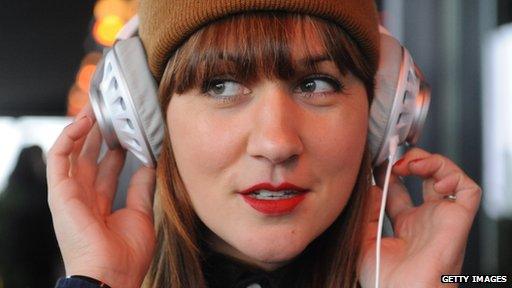 woman listening to headphones