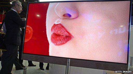 woman pouting on giant TV Screen