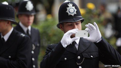 Police officer using camera phone