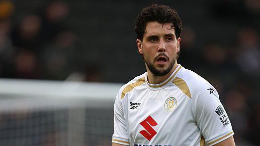 Mk Dons' Jack Sanders in action