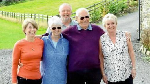 Christine Booker (second from left) with her family