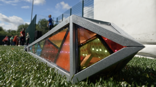 A multicoloured lantern top lay on the ground