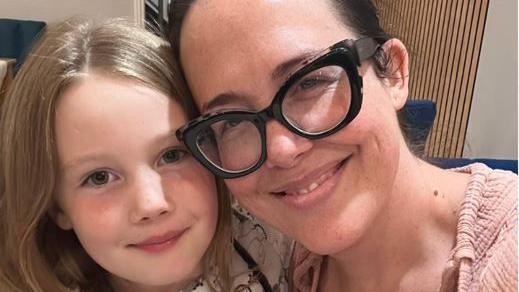 Selfy of Danielle and her daughter. Danielle is wearing glasses with a black frame.