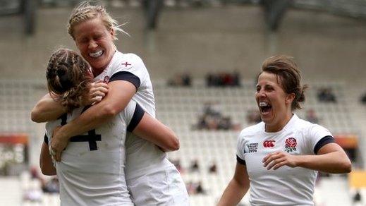 England captain Katy Mclean (R) and Danielle Waterman of England (C) celebrate with Katherine Merchant