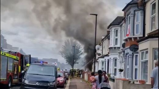 Firefighters tackling fire the fatal house fire in East Ham