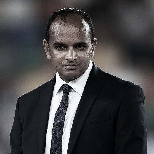 A close-up picture of Vinai Venkatesham looking focused in a suit and tie