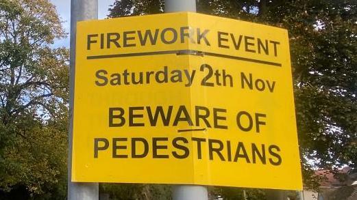 Yellow sign that reads: "Firework event, Saturday 2th Nov, beware of pedestrians."