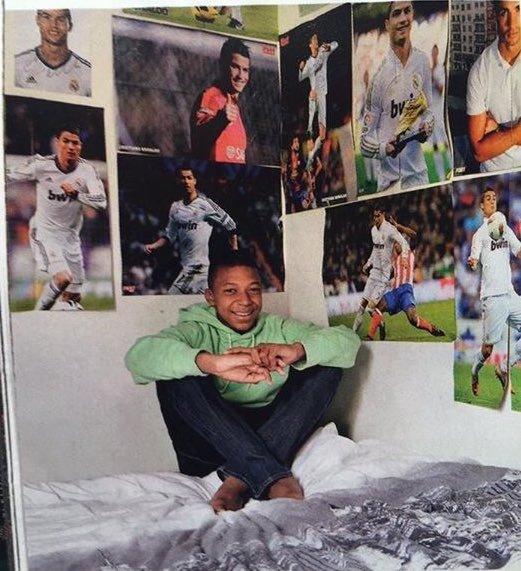 Mbappé's bedroom with Ronaldo posters.