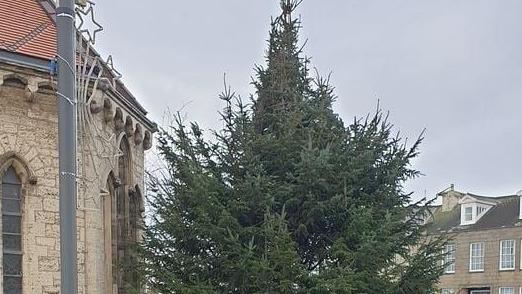 The tree before it was decorated near the church in 2022.